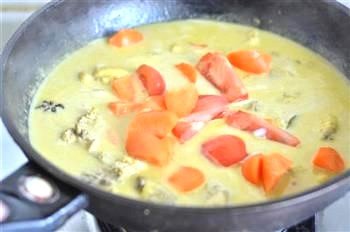 Curry Chicken and Dumplings Boiling with Carrots